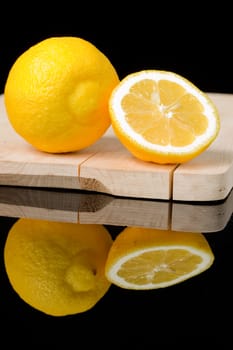 chopped up yellow lemon in dark backdrop