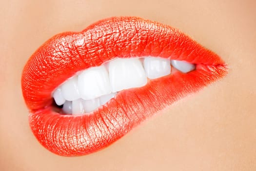 sensual mouth of a young woman bitting a lip in a sexy expression