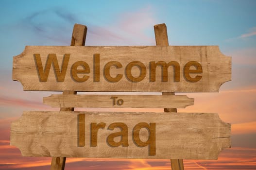 welcome to iraq sing on wood background