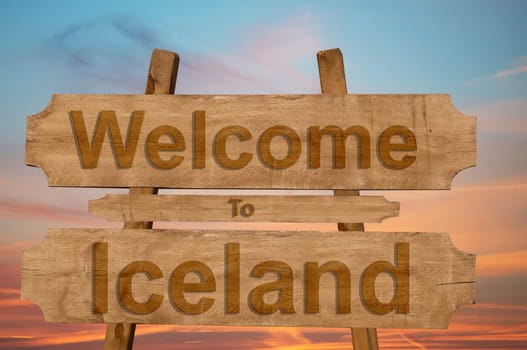 welcome to iceland sing on wood background