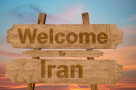 welcome to iran sing on wood background