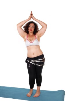 A beautiful young woman standing bare feet on the floor and belly .dancing with coins around her hips, isolated for white background..