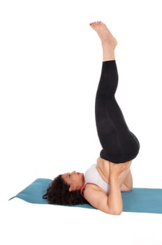 A young woman lying on the floor lifting up her legs in black yoga pants,.isolated for white background..