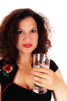 A very pretty young woman in a black dress holding a glass of water,.looking into the camera, isolated for white background..