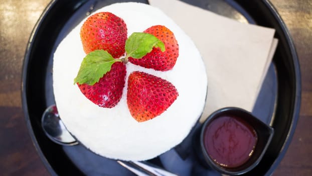 Refreshing iced strawberry dessert on top view, stock photo