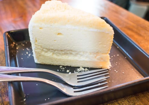 Piece of homemade cheese cake, stock photo