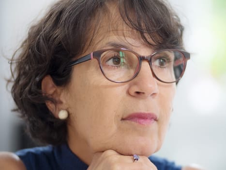 portrait of a beautiful mature woman with glasses
