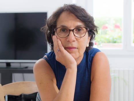 portrait of a beautiful mature woman with glasses