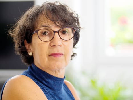 portrait of a beautiful mature woman with glasses