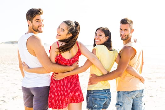 Group of friends having fun at the beach
