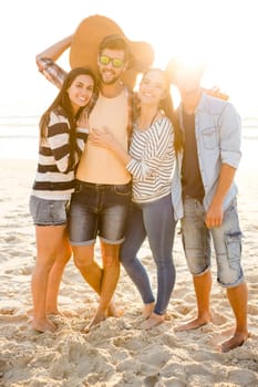 Friends at the beach having fun together