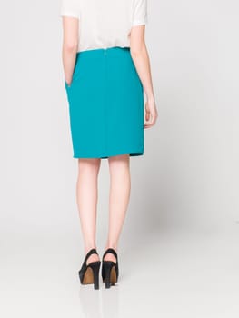 a beautiful model wearing feminine clothes in clear background