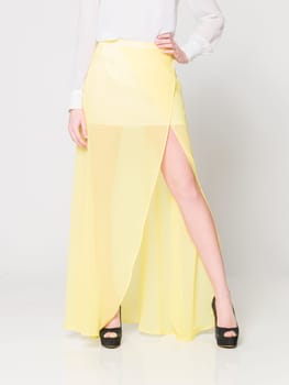 a beautiful model wearing feminine clothes in clear background