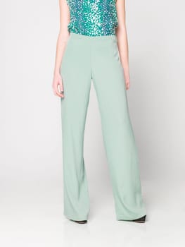 a beautiful model wearing feminine clothes in clear background