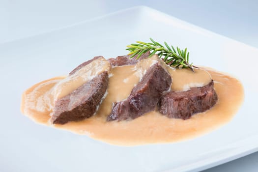 delicious traditional recipe from spain cheek on a white plate
