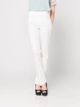 a beautiful model wearing feminine clothes in clear background