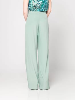 a beautiful model wearing feminine clothes in clear background