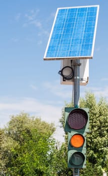 Road traffic light powered by electricity generated from a solar panel