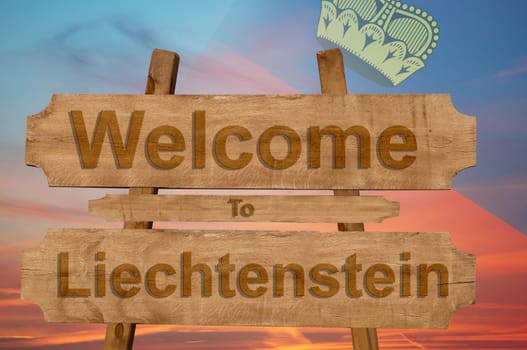 welcome to liechtenstein sign on wood background with blending national flag