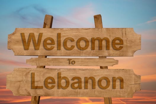 welcome to lebanon sign on wood background