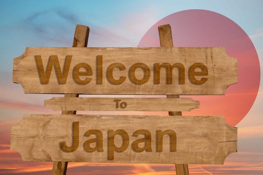 welcome to japan sign on wood background with blending national flag
