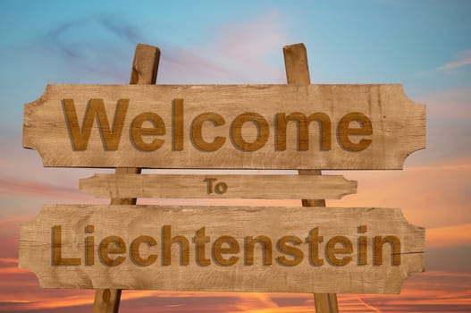 welcome to liechtenstein sign on wood background