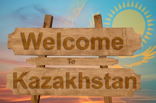 welcome to kazakhstan sign on wood background with blending national flag