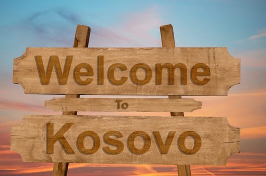 welcome to kosovo sign on wood background
