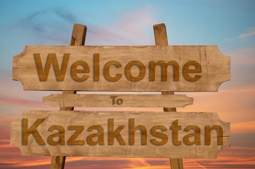 welcome to kazakhstan sign on wood background