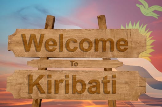 welcome to kiribati sign on wood background with blending national flag