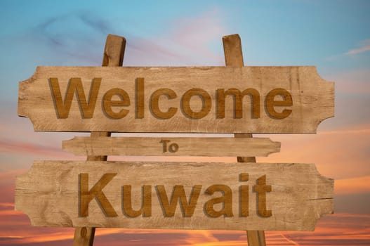 welcome to kuwait sign on wood background
