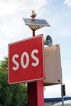 SOS sign and call for help in the port. SOS shield for quick help