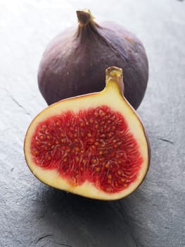 Fresh organic figs on a dark slate background, closeup shot
