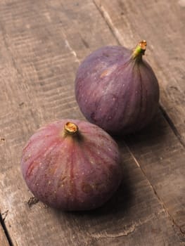 Fresh figs on a rustic wooden background