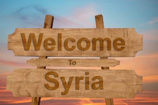welcome to jamaica sign on wood background with blending national flag