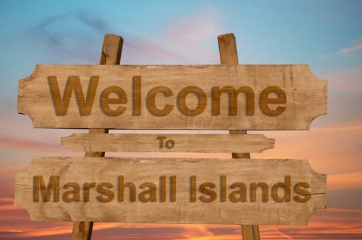 welcome to jamaica sign on wood background with blending national flag