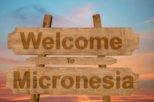 welcome to jamaica sign on wood background with blending national flag