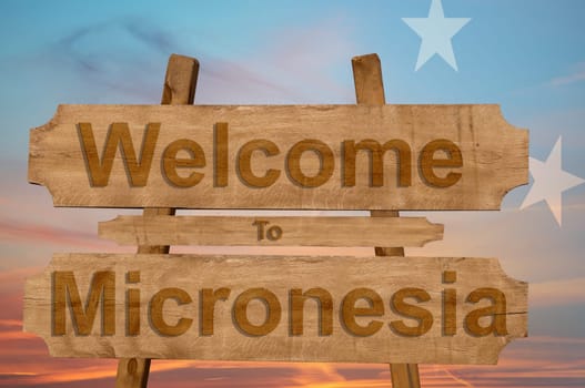 welcome to jamaica sign on wood background with blending national flag
