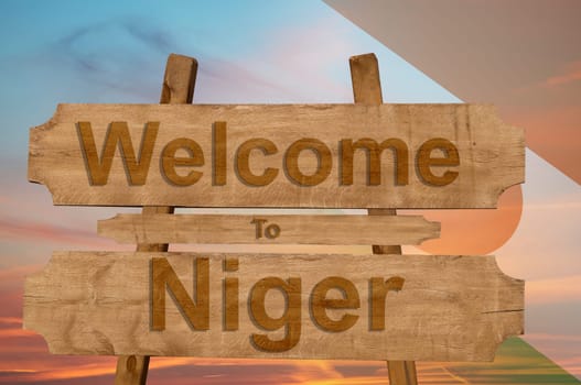 welcome to jamaica sign on wood background with blending national flag