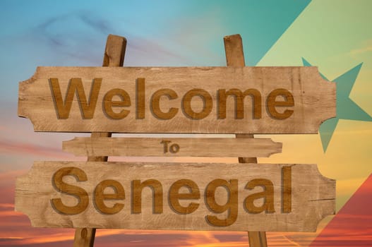 welcome to jamaica sign on wood background with blending national flag