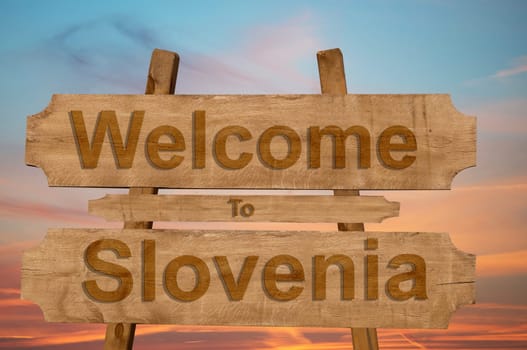 welcome to jamaica sign on wood background with blending national flag