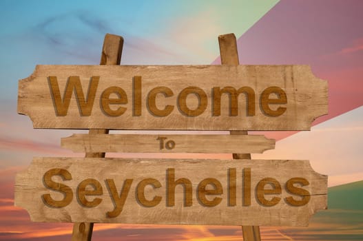 welcome to jamaica sign on wood background with blending national flag