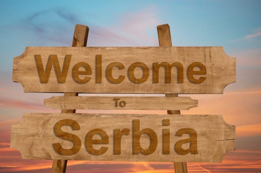 welcome to jamaica sign on wood background with blending national flag