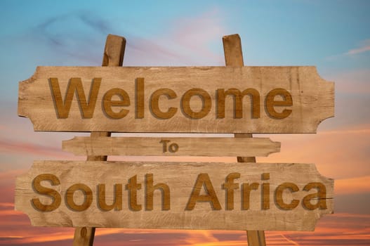 welcome to jamaica sign on wood background with blending national flag