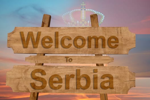welcome to jamaica sign on wood background with blending national flag