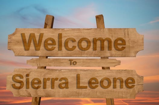 welcome to jamaica sign on wood background with blending national flag