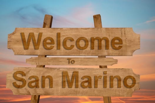 welcome to jamaica sign on wood background with blending national flag