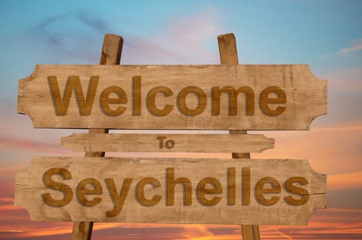 welcome to jamaica sign on wood background with blending national flag