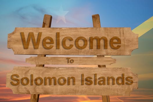 welcome to jamaica sign on wood background with blending national flag