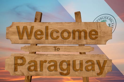 welcome to jamaica sign on wood background with blending national flag